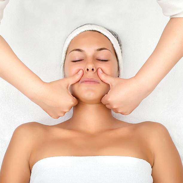 Close-up of forehead massage in a clean spa environment